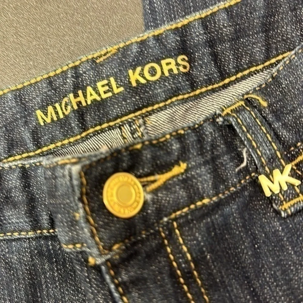 94.  Michael Kors dark blue skinny jeans with embellished pockets size 4